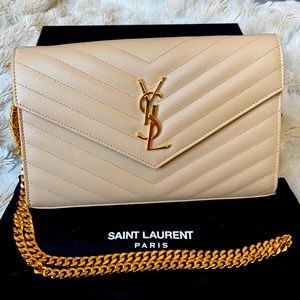YSL Monogram beige envelope on a chain wallet.